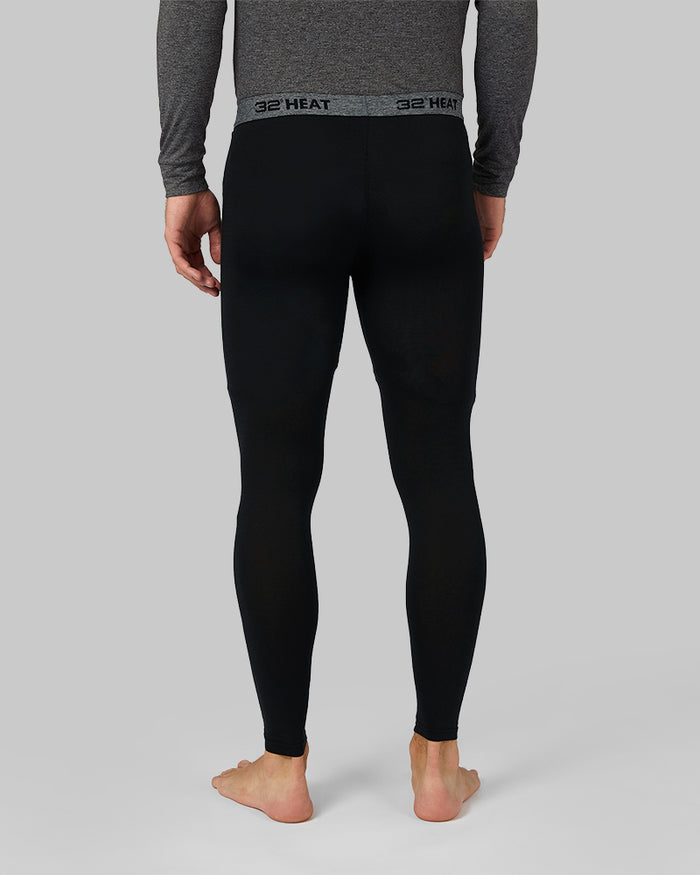 32 Degrees Black _ Men's Lightweight Baselayer Legging {model: Jacque is 6'2", wearing size M}{bottom}{right} {bottom}{right}