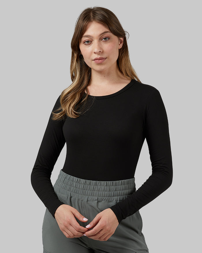 32 Degrees Black _ Women's Lightweight Baselayer Crew Top {model: Julia is 5'8"and size 4 wearing size S}{bottom}{right} {bottom}{right}