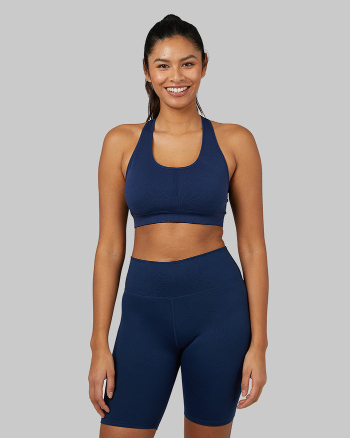32 Degrees Inky Indigo _ Womens Seamless Racerback Sports Bra {model: Victoria is 5'10" and size 4-6, wearing size S}{bottom}{right} {bottom}{right}